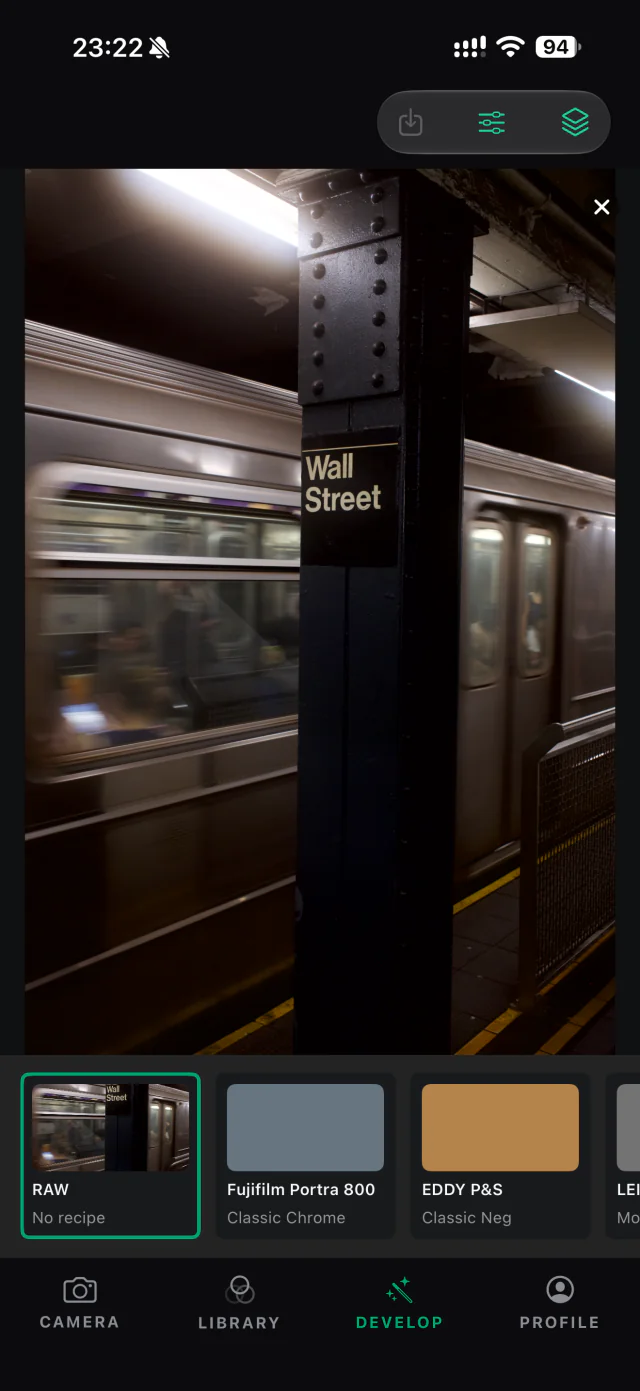 The color RAW view of a moving train at Wall Street station